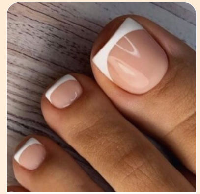 Classic red nail polish on well-groomed feet