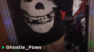 Real FeetFinder profile thumbnail showing a goth-aesthetic outfit with a Misfits skull logo, username Ghostie_Paws at the bottom